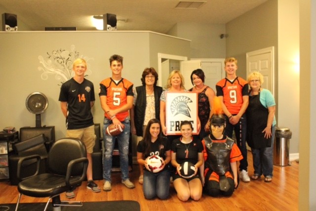 people wearing jerseys and holding sign